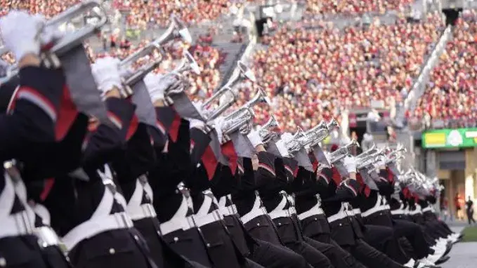 Ohio State Marching Band members playing at the stadium.