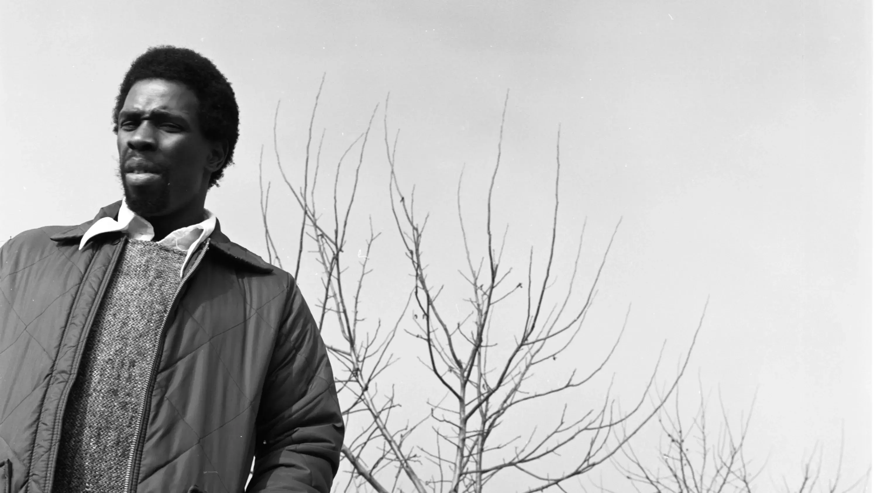 A black and white image of Charles Gaines outside