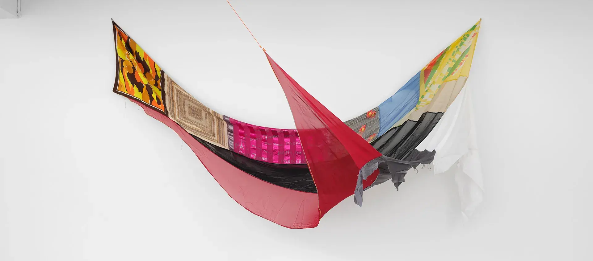 Artwork made of suspended fabric composed on different colored panels