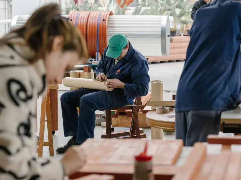 Several people work in workshop