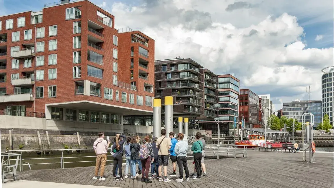 Students viewing studying new residential and commercial buildings in Sandtorhafen, Hamburg’s oldest harbor basin.  