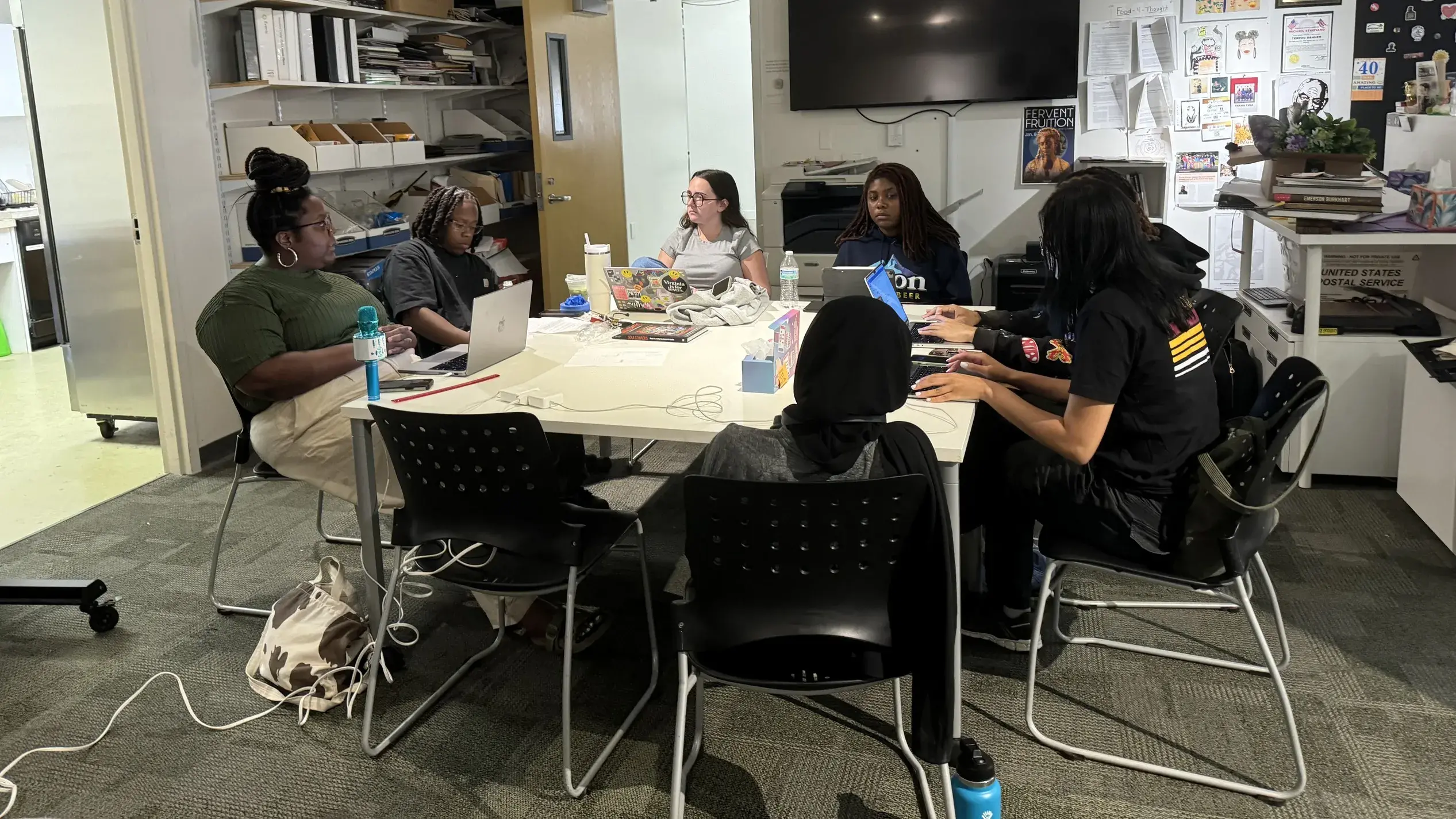 Interns sitting around a table