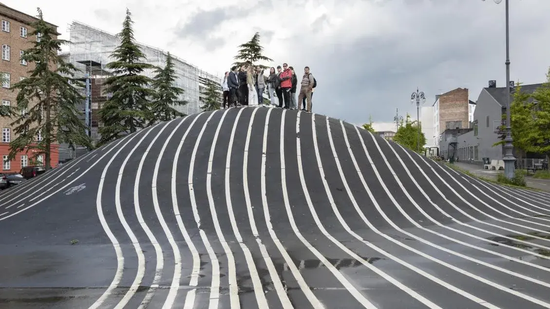 The study abroad group at Superkilen Park as they begin a tour of the Nørrebro neighborhood in Copenhagen.