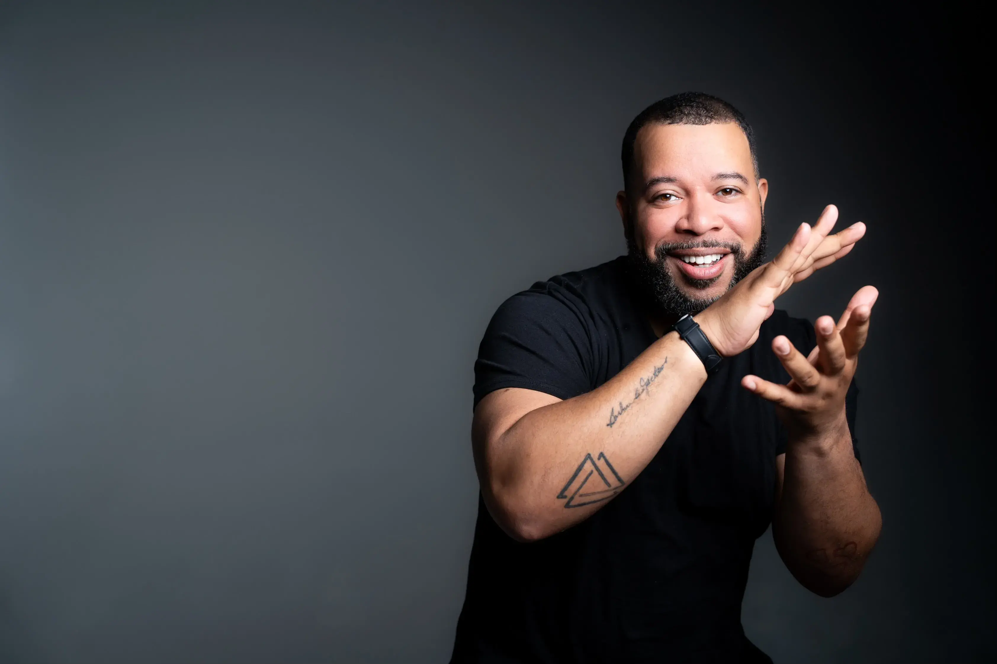 Ryan Johnson portrait in a sudio with a dark background