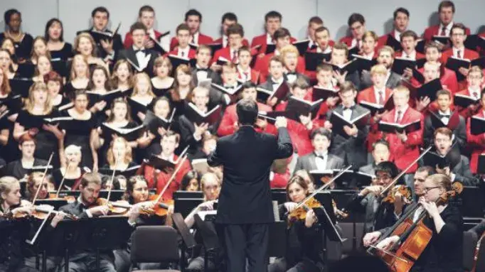 A conductor conducting an ensemble.