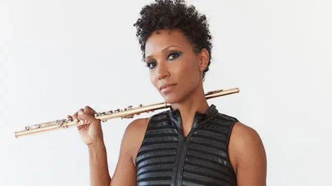 Allison Loggins-Hall holding a flute. 