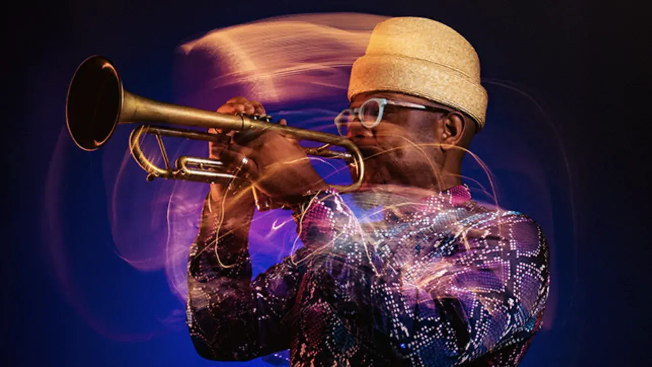 Man playing the trumpet on a purple ombre background