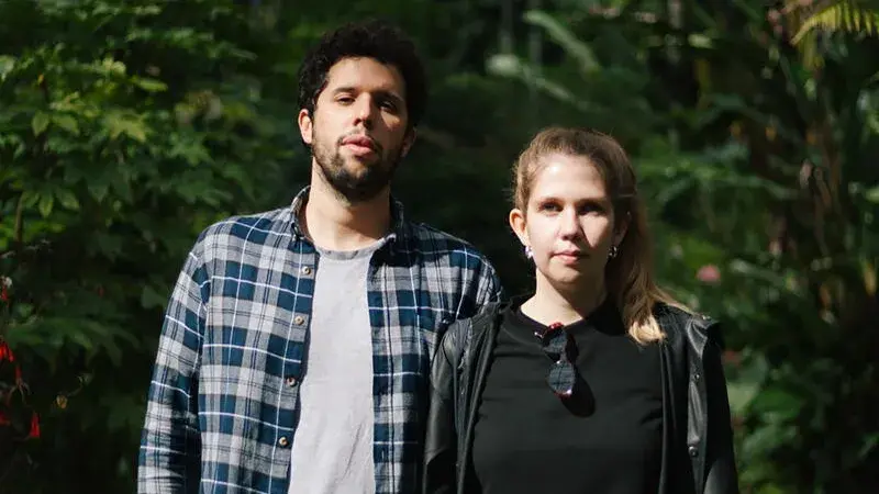 João Paupério and Maria Rebelo stand outside