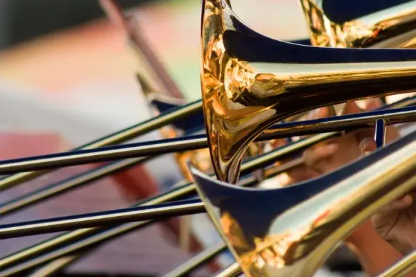 Close up of multiple trombones.