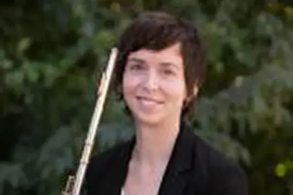 Claire Chase posing with a flute.