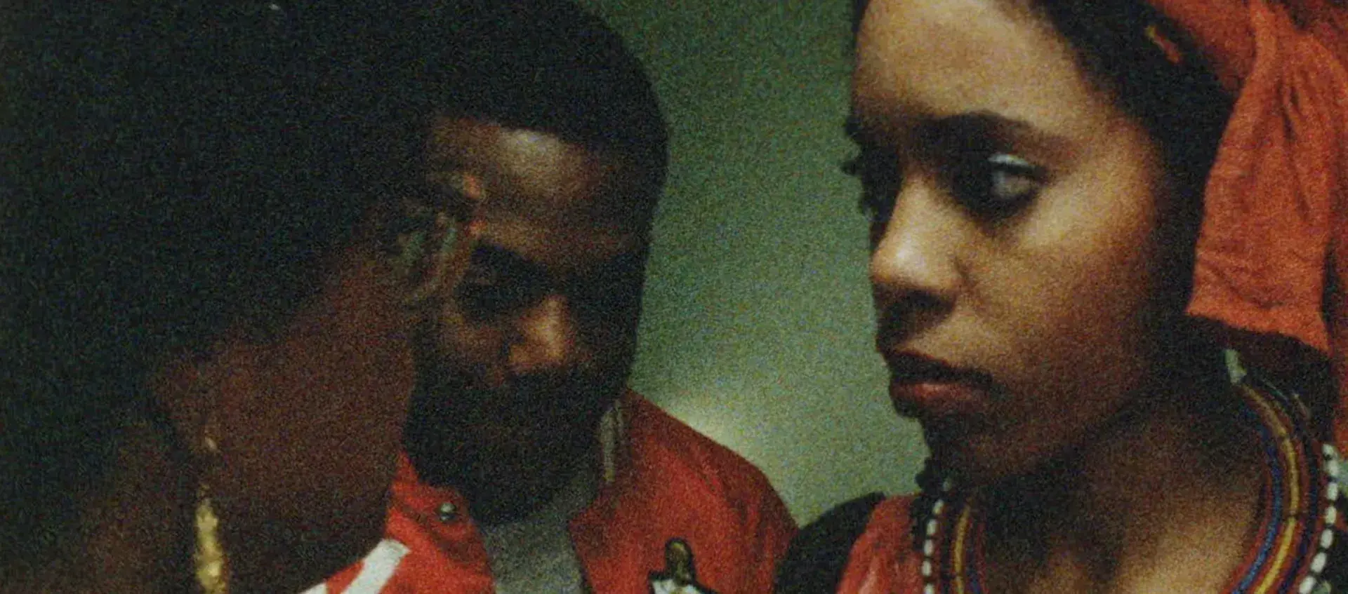 Several people look at each other or down at the floor