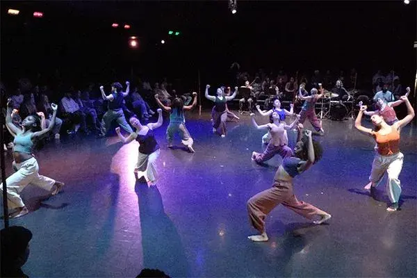 Group of people dancing on a stag