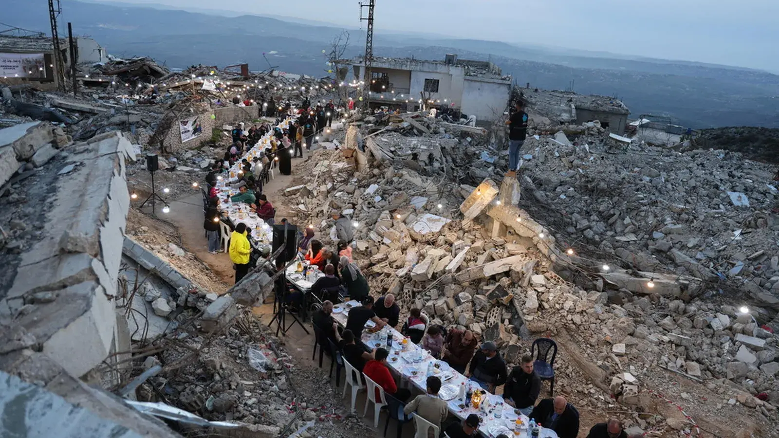 Mass Iftar program among rubble in Lebanon.