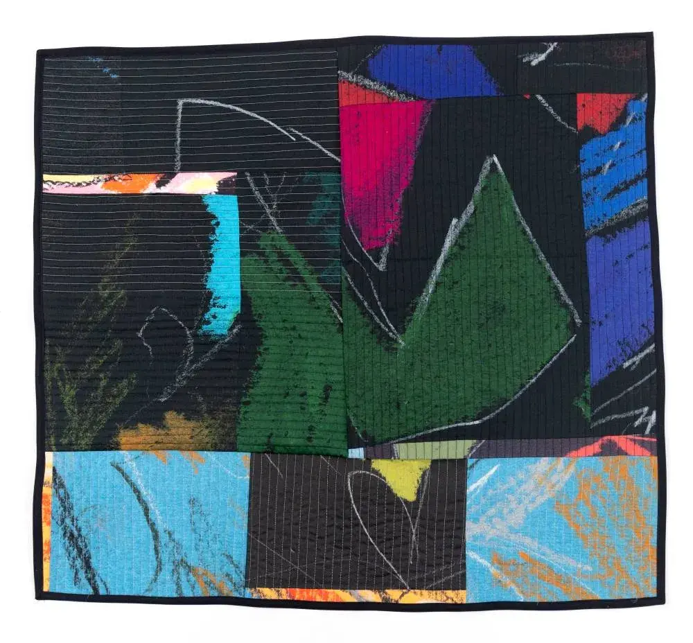 Abstract artwork with areas of black, dark green, light and dark blue, and pink