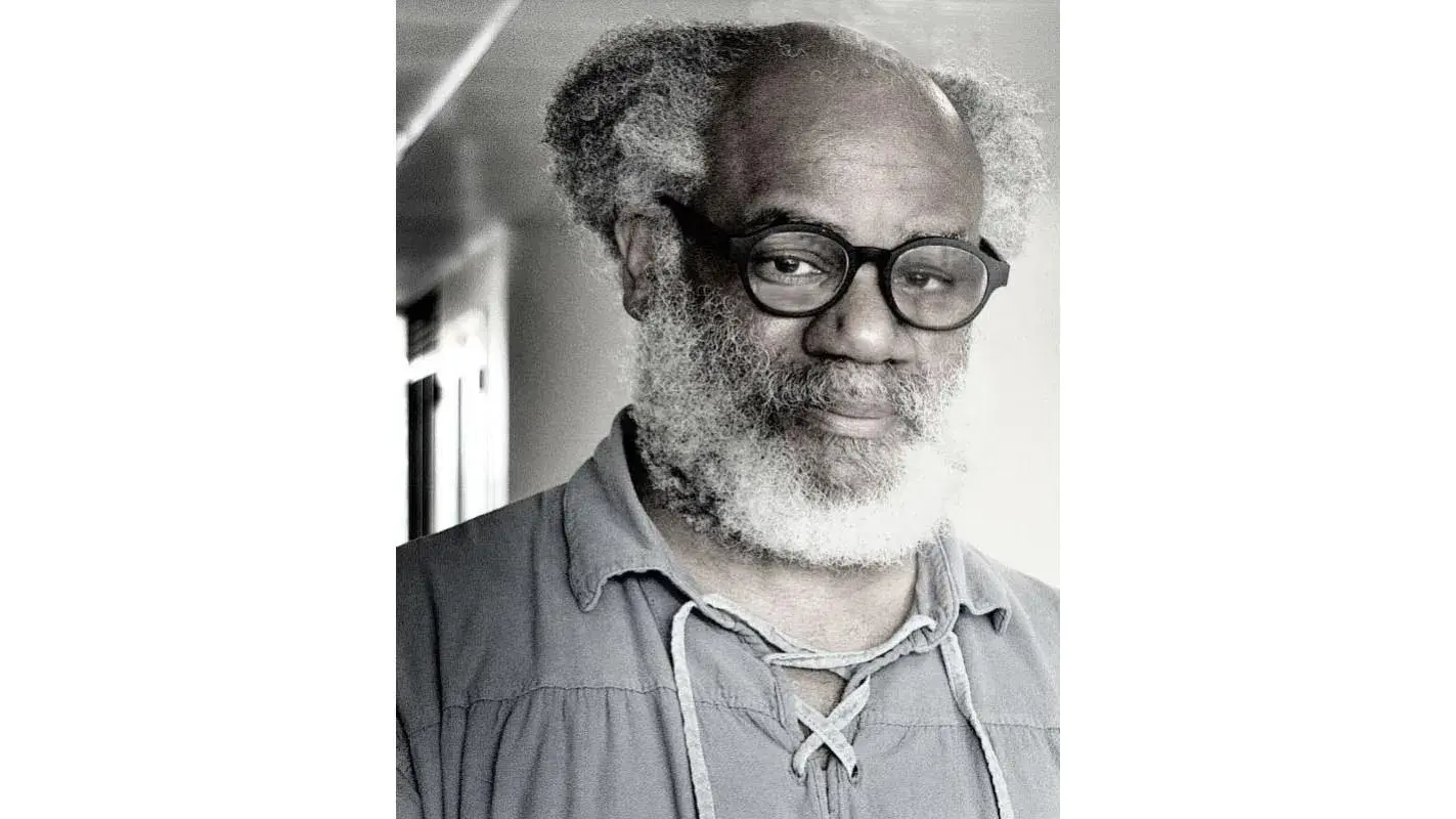 Headshot of Jeremy Mumford, a Black man wearing glasses and a white beard