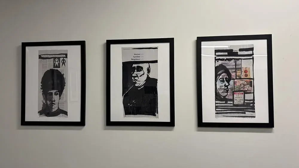 Three framed artworks on a wall