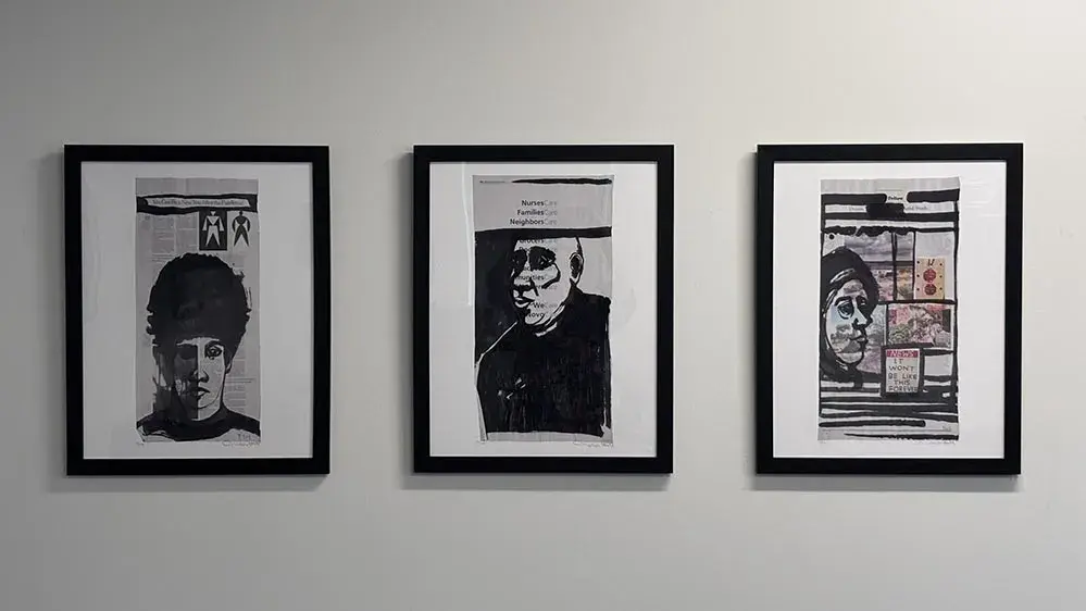 Three framed artworks on a wall