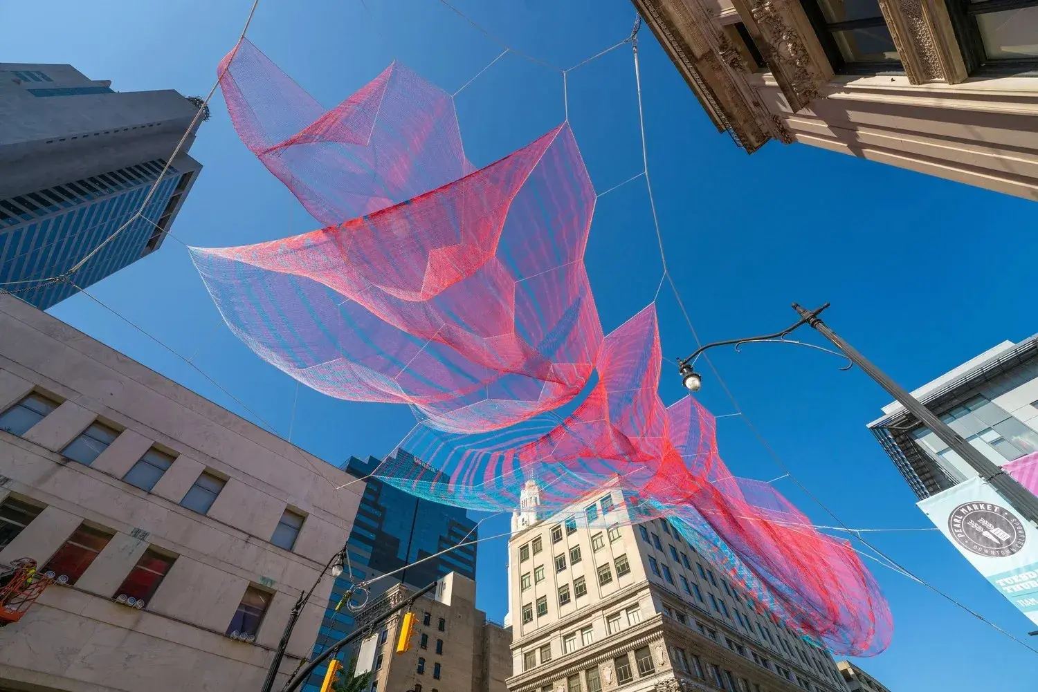 Suspended artwork in red and blue material
