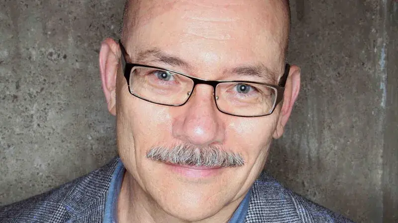 a headshot of Greg Castillo