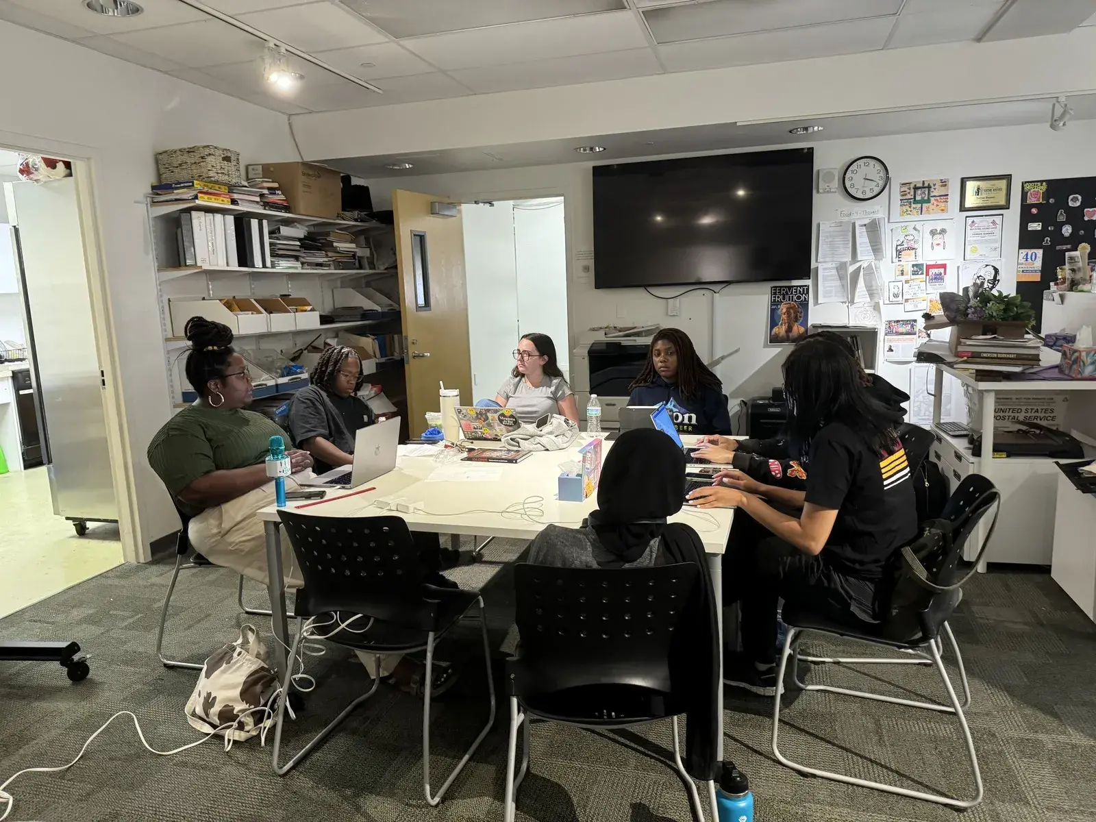 Interns sitting around a table